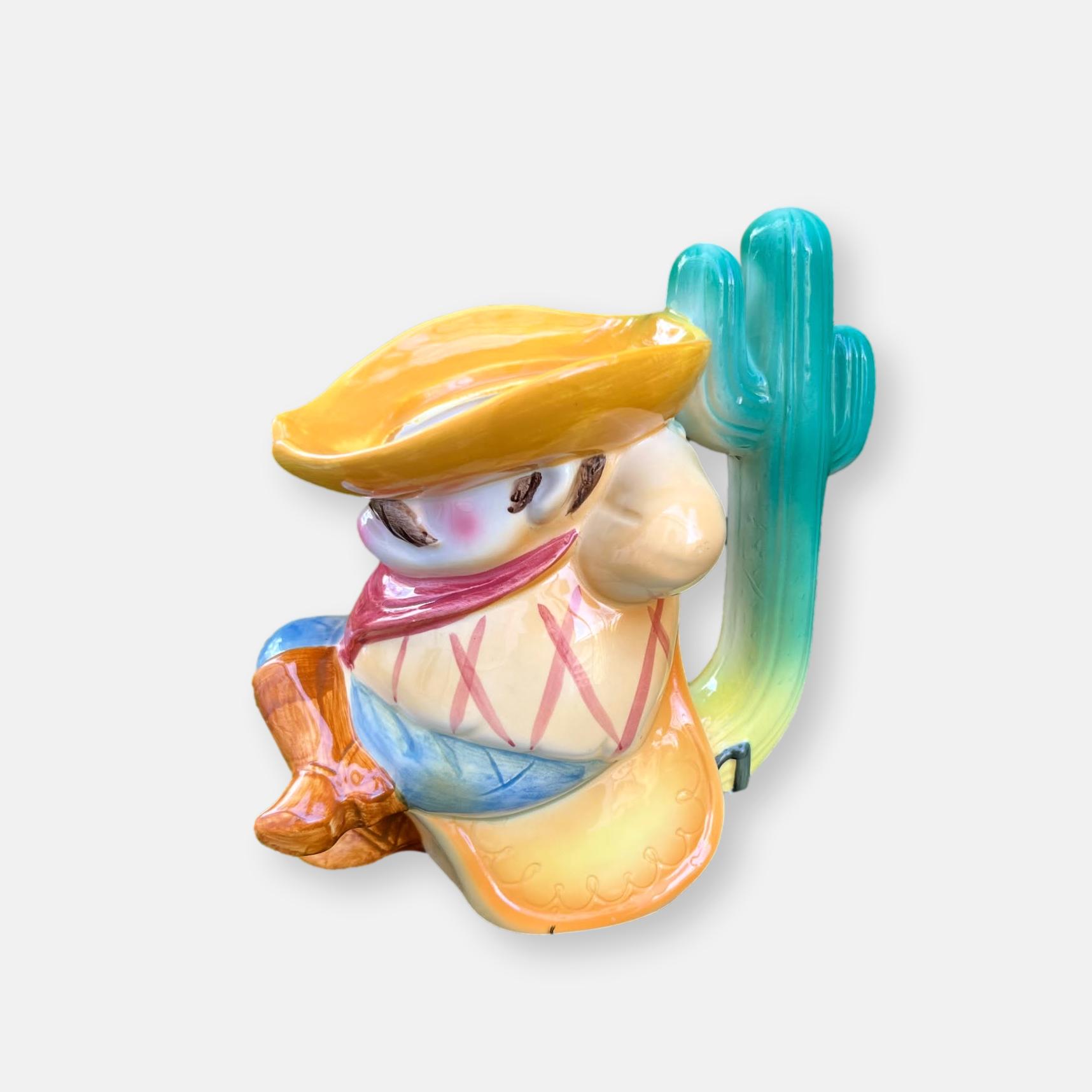 Pichet en barbotine en forme de mexicain